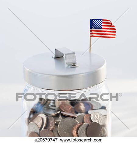 Stock Photo - Coins in jar. Fotosearch