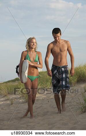 Couple at the beach View Large Photo Image Picture - Couple at the beach. Fotosearch