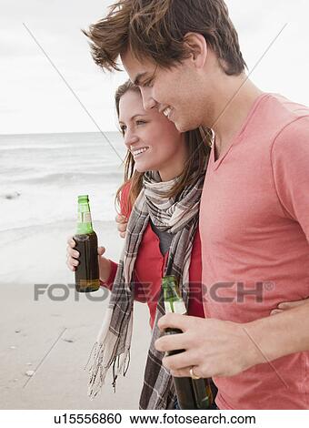 Stock Image - Couple at the beach. Fotosearch