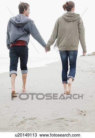 Stock Image - Couple holding hands. Fotosearch