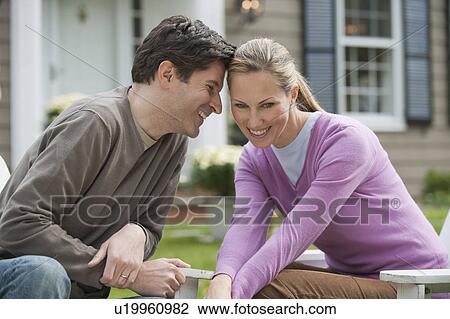Couple in front of house View Large Photo Image Stock Image - Couple in front of house. Fotosearch
