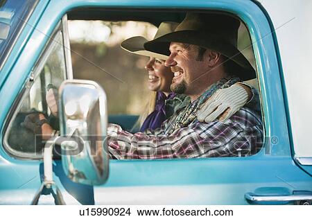 Picture - Couple in truck. Fotosearch