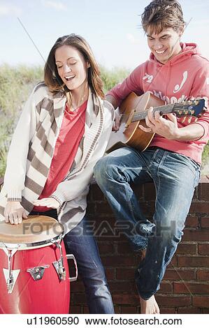 Couple playing instruments View Large Photo Image Stock Image - Couple playing instruments. Fotosearch