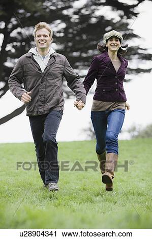Stock Image - Couple running. Fotosearch