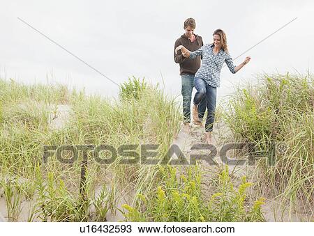 Couple walking View Large Photo Image Stock Image - Couple walking. Fotosearch