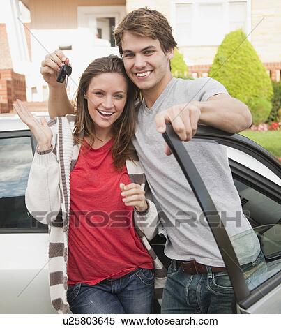 Stock Photography - Couple with car keys. Fotosearch