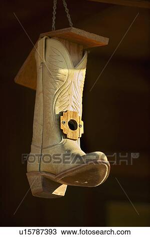 Stock Image - Cowboy boot bird house. Fotosearch