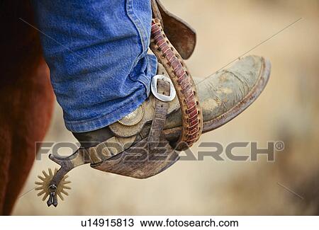 Stock Image - Cowboy boot with spur. Fotosearch