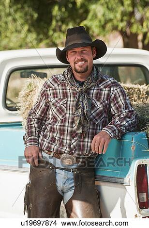 Cowboy leaning on truck View Large Photo Image Picture - Cowboy leaning on truck. Fotosearch