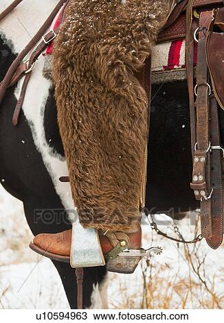 Stock Image - Cowboy on horse. Fotosearch