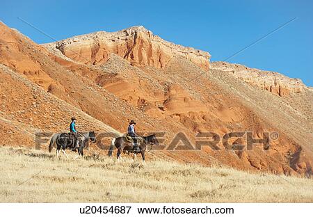Stock Photo - Cowboys. Fotosearch