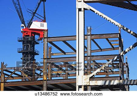 Stock Image - Crane at construction site. Fotosearch