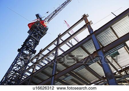 Stock Image - Crane at construction site. Fotosearch