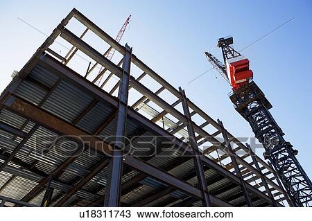 Stock Image - Crane at construction site. Fotosearch