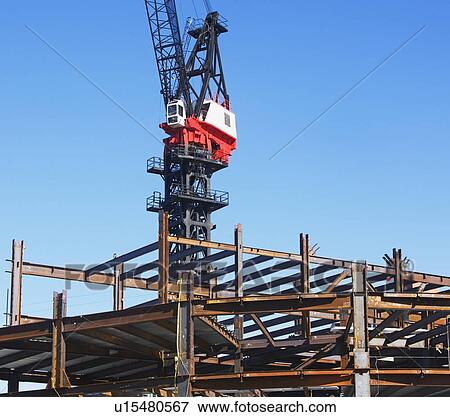 Crane at construction site View Large Photo Image Stock Photo - Crane at construction site. Fotosearch