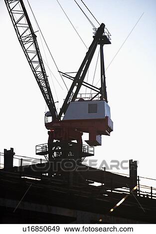 Stock Photo - Crane at construction site. Fotosearch