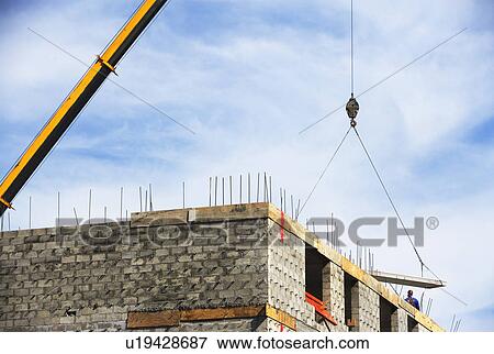 Stock Photo - Crane at construction site. Fotosearch