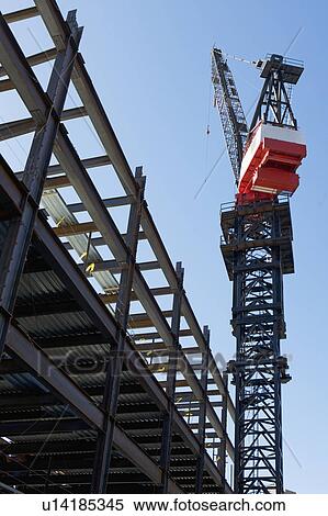 Crane at construction site View Large Photo Image Stock Photography - Crane at construction site. Fotosearch