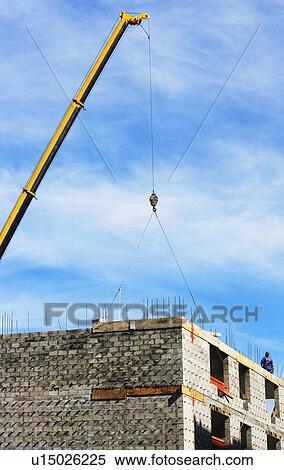 Crane at construction site View Large Photo Image Stock Photography - Crane at construction site. Fotosearch