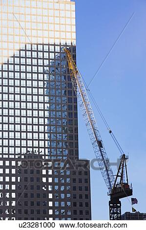 Crane beside skyscraper View Large Photo Image Stock Image - Crane beside skyscraper. Fotosearch