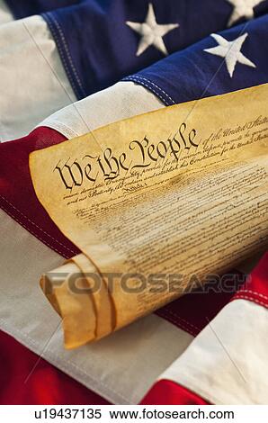 Stock Photography - Declaration of Independence of top of American flag. Fotosearch