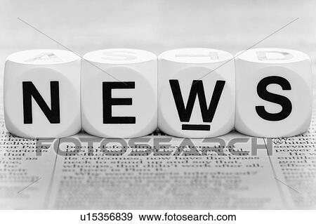 Stock Photo - Dice on top of newspaper. Fotosearch