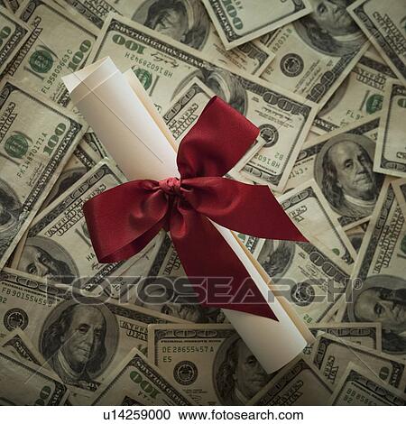 Stock Image - Diploma and money. Fotosearch