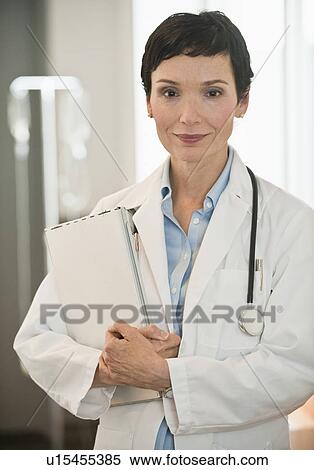 Doctor holding chart View Large Photo Image Stock Photography - Doctor holding chart. Fotosearch