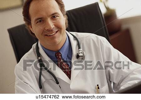Stock Image - Doctor in his office. Fotosearch