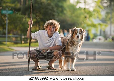 Stock Image - Dog and his owner. Fotosearch