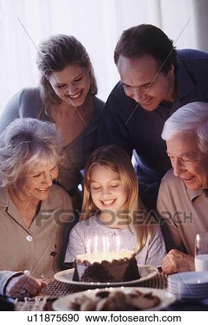 Stock Image - Family celebrating birthday. Fotosearch