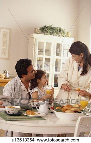 Family eating breakfast View Large Photo Image Picture - Family eating breakfast. Fotosearch