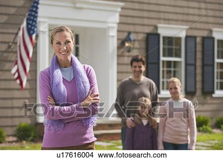 Family in front of house View Large Photo Image Picture - Family in front of house. Fotosearch