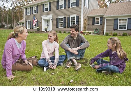 Family in front of house View Large Photo Image Stock Photo - Family in front of house. Fotosearch
