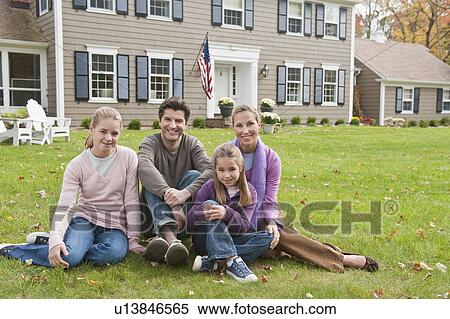 Family in front of house View Large Photo Image Stock Photography - Family in front of house. Fotosearch