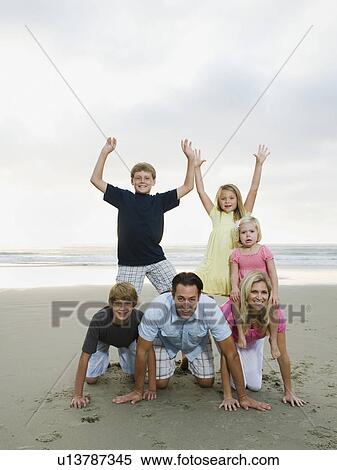 Stock Photography - Family portrait at the beach. Fotosearch