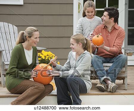 Family sitting on deck View Large Photo Image Stock Image - Family sitting on deck. Fotosearch