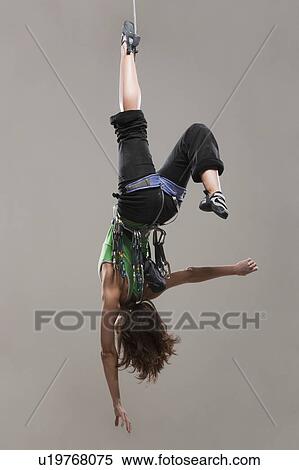 Female Climber hanging upside down View Large Photo Image Stock Photography - Female Climber hanging upside down. Fotosearch