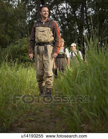 Stock Photography - Fly Fisherman walking on path. Fotosearch