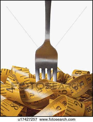 Stock Photo - Fork in measuring tape. Fotosearch