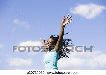Stock Image - Girl jumping. Fotosearch