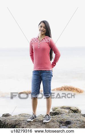 Girl standing in front of ocean View Large Photo Image Stock Photograph - Girl standing in front of ocean. Fotosearch