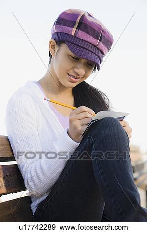 Girl writing View Large Photo Image Stock Photo - Girl writing. Fotosearch