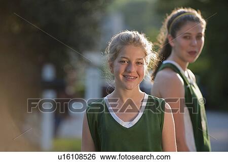 Girls in sports uniforms View Large Photo Image Stock Photograph - Girls in sports uniforms. Fotosearch