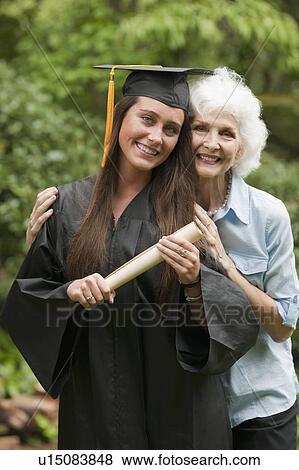 Stock Photo - Graduate and elderly woman. Fotosearch