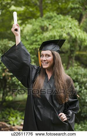 Stock Photograph - Graduate with diploma. Fotosearch