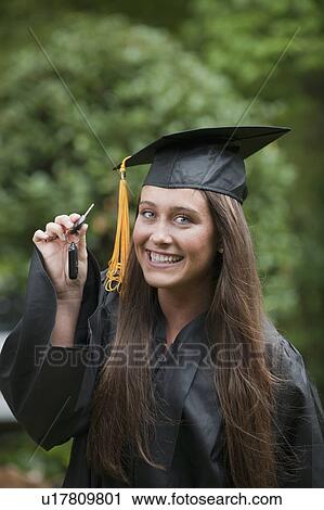 Stock Image - Graduate with keys. Fotosearch