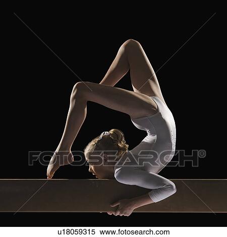 Gymnast on balance beam View Large Photo Image Stock Photography - Gymnast on balance beam. Fotosearch
