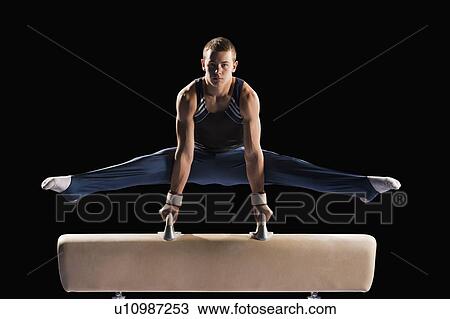 Gymnast on pommel horse View Large Photo Image Stock Image - Gymnast on pommel horse. Fotosearch
