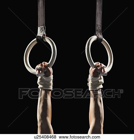 Gymnast swinging from rings View Large Photo Image Stock Photo - Gymnast swinging from rings. Fotosearch